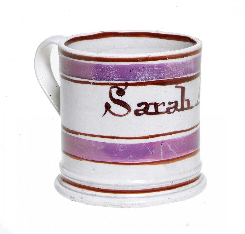 Appraisal: A PINK LUSTRE MUG inscribed in rust enamel Sarah Ann