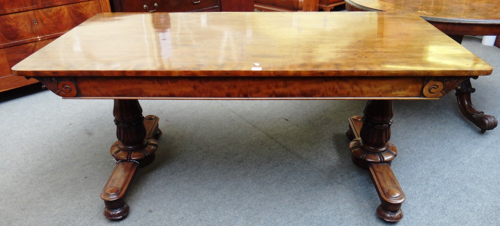 Appraisal: A Regency figured mahogany library table the rounded rectangular top