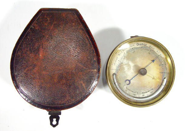 Appraisal: Victorian brass cased aneroid barometer with thermometer in a velvet