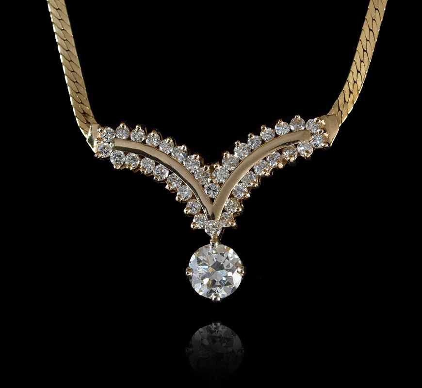 Appraisal: CTW DIAMOND NECKLACE WITH A CT CENTER K yellow gold