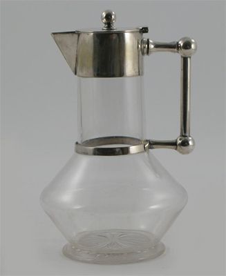 Appraisal: An electroplated metal decanter in the manner of Dr Christopher