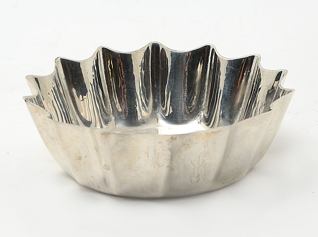 Appraisal: SMALL CARTIER STERLING NUT BOWL Scalloped sides marked on base