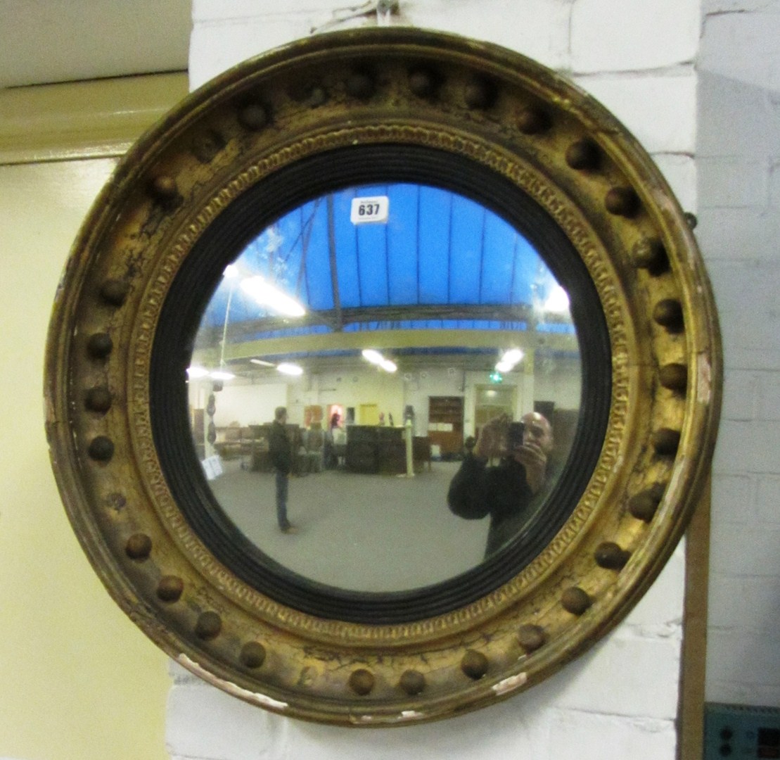 Appraisal: A th century gilt framed ball mounted circular convex wall