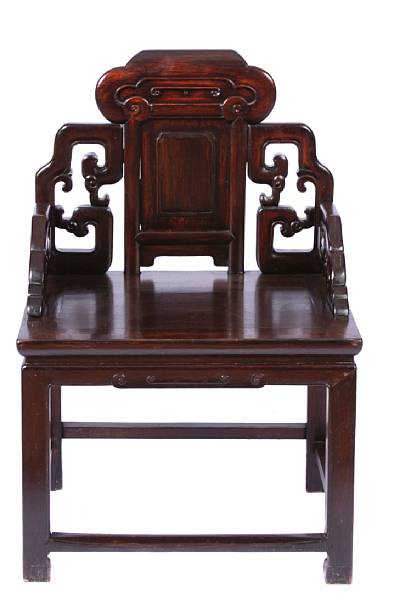 Appraisal: A pair of Chinese carved hardwood armchairs the shaped pierced