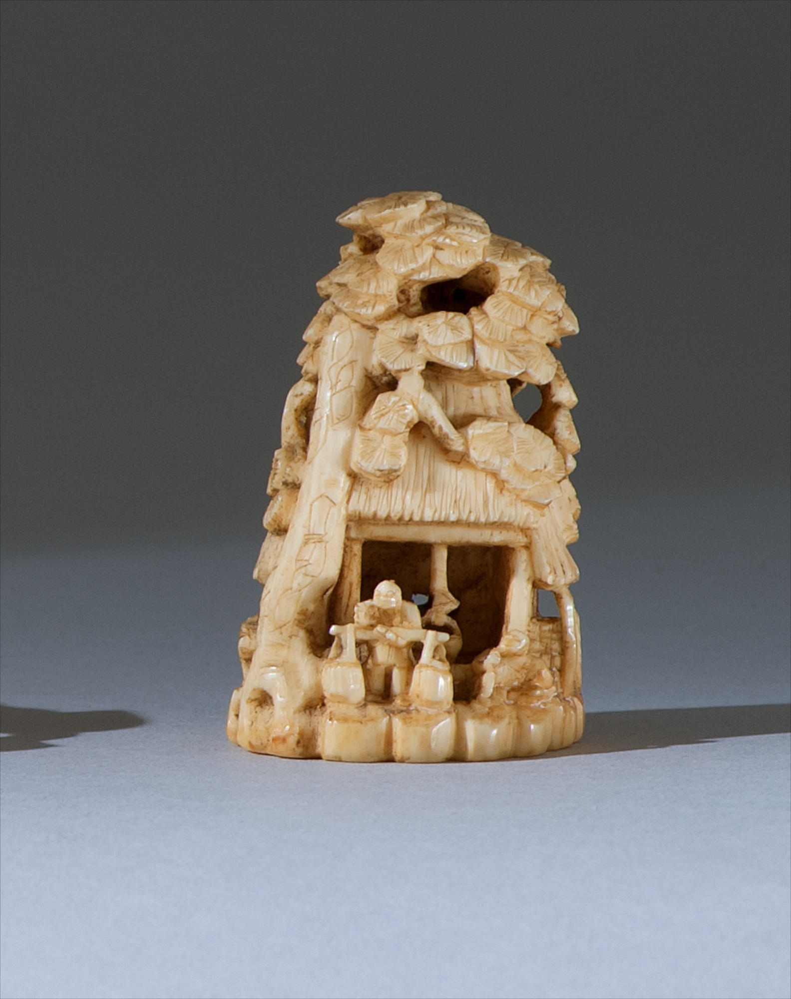 Appraisal: IVORY NETSUKE th CenturyIn the form of a peasant cottage