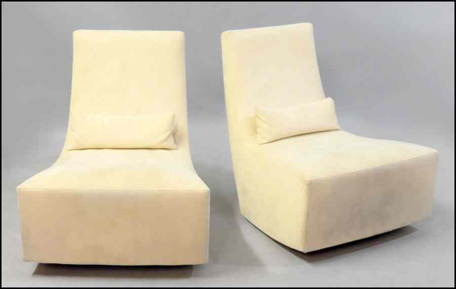 Appraisal: PAIR OF LIGNE ROSET CHAIRS Together with an upholstered rocking