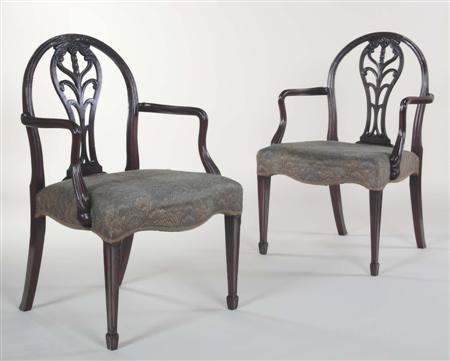 Appraisal: A pair of Hepplewhite arm chairs each with arched foliate