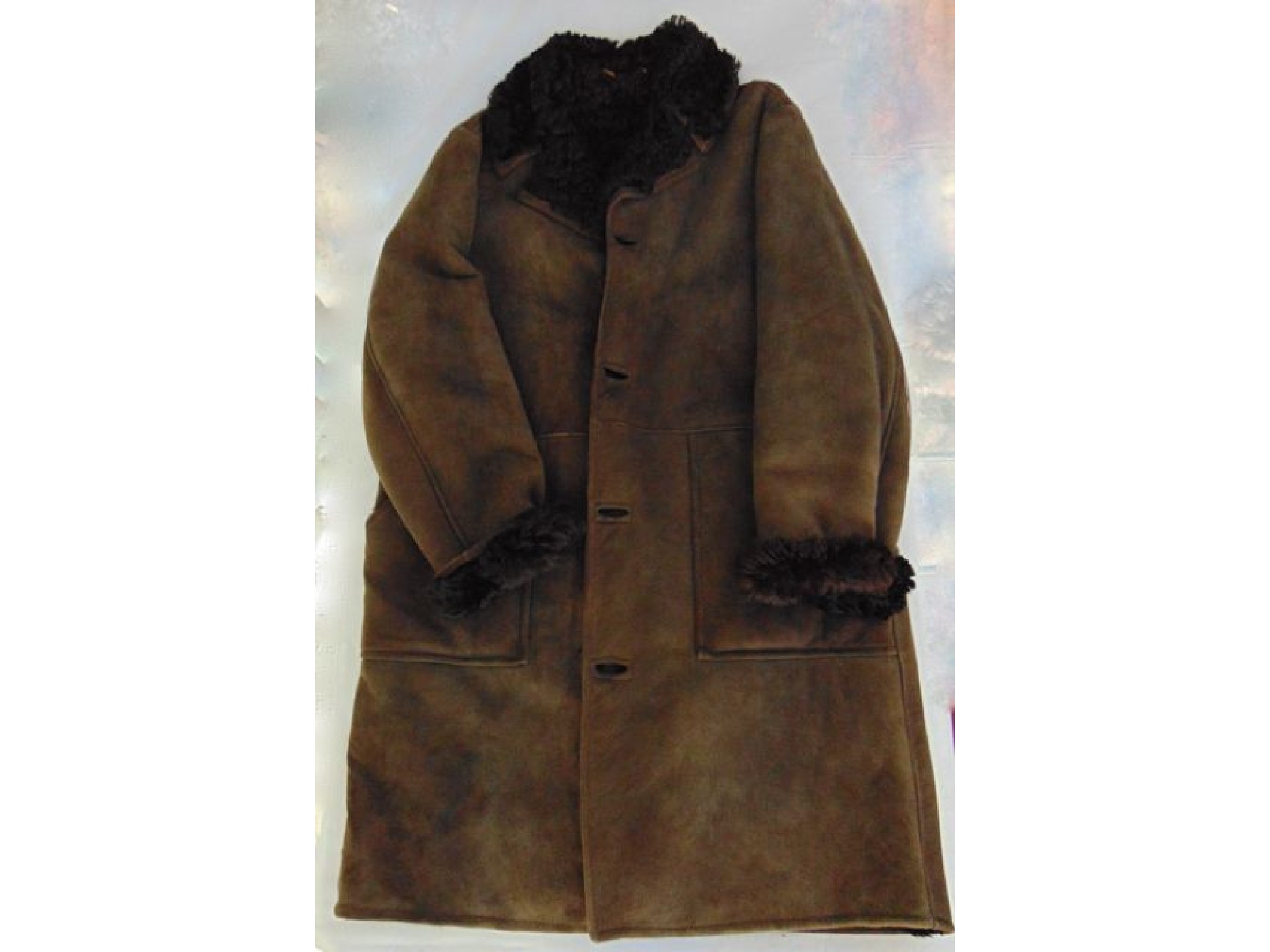 Appraisal: A vintage sheepskin jacket with lambswool lining complete with original