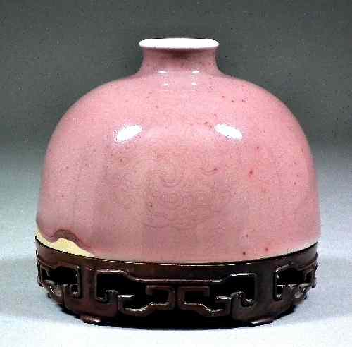 Appraisal: A Chinese pale sang-de-boeuf glazed porcelain ''beehive'' shaped water pot