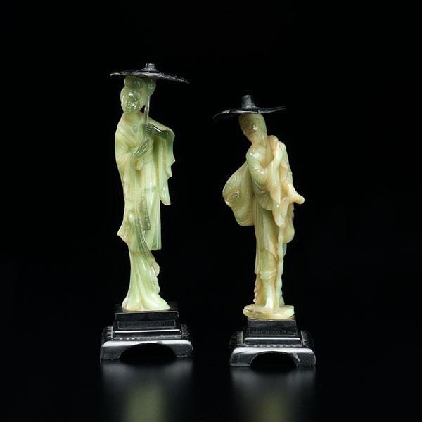 Appraisal: Japanese th century A pair of carved hard stone figures