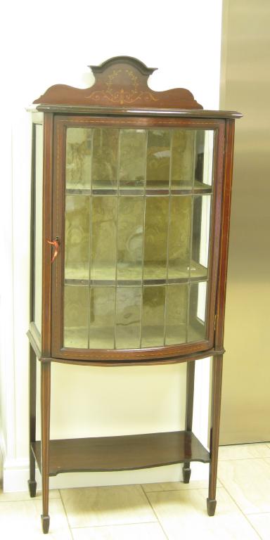 Appraisal: An Edwardian mahogany bow front Display cabinet with single leaded