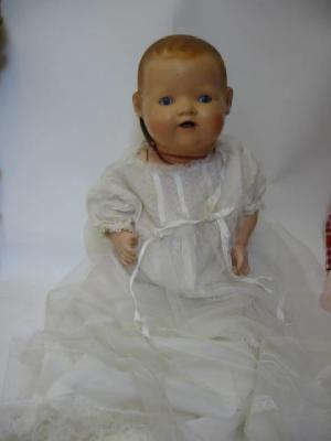 Appraisal: A German bisque head Dream baby doll with blue glass