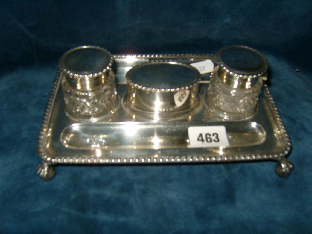 Appraisal: A silver inkstand of rectangular form with gadroon border on