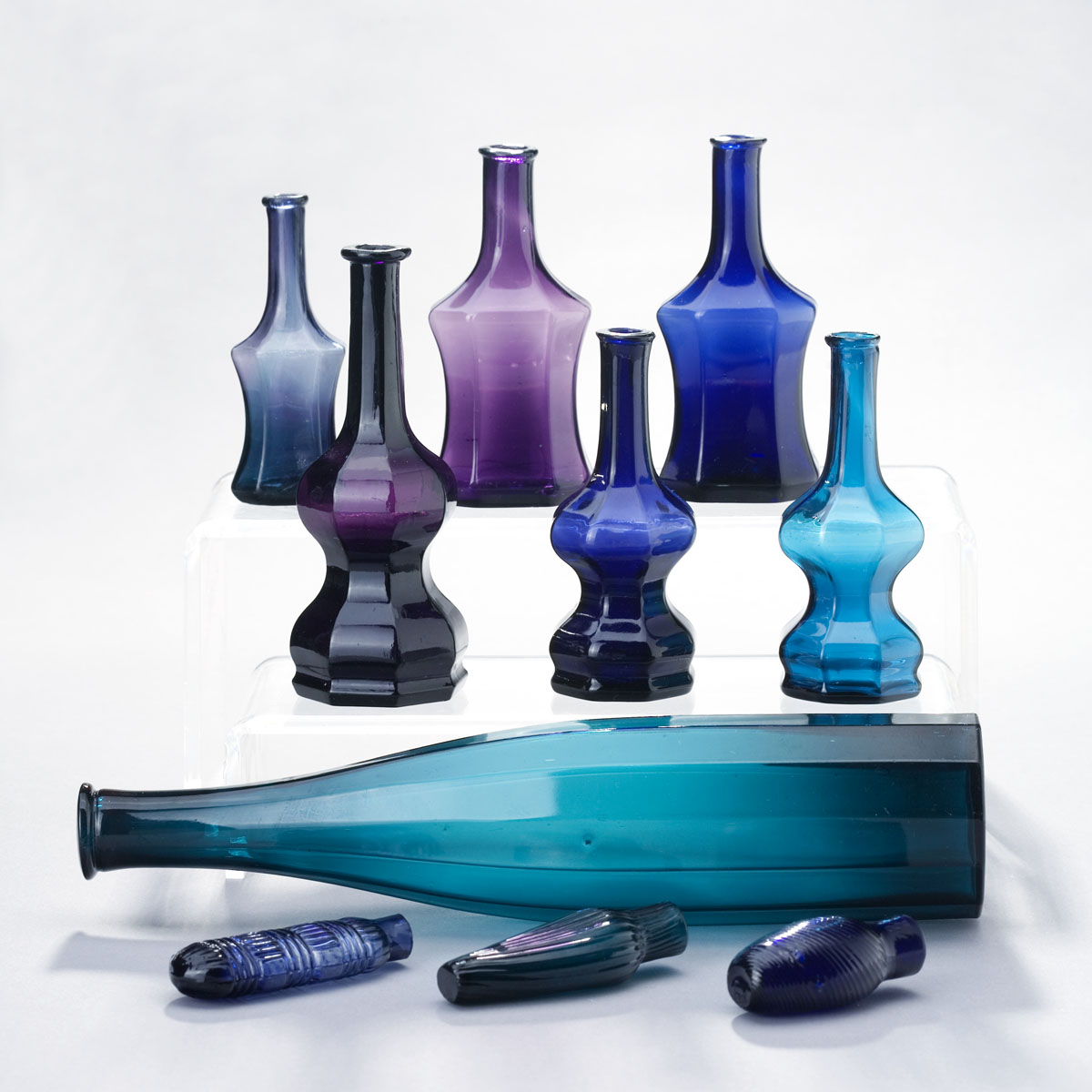 Appraisal: THREE BLOWN-MOLDED PANELED COMMERCIAL COLOGNES BOSTON AND SANDWICH GLASS COMPANY