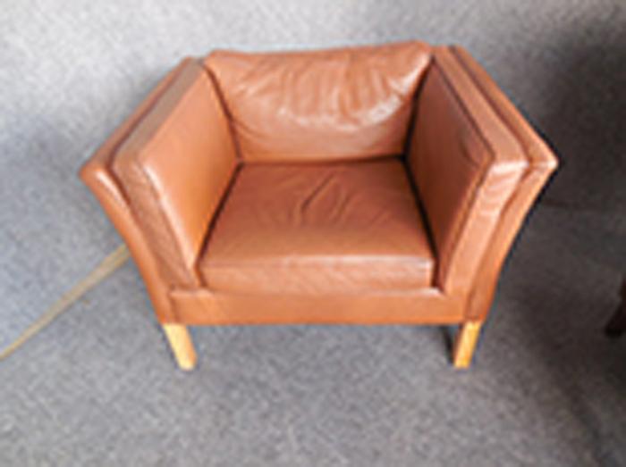 Appraisal: MOGENS HANSEN DANISH BORN BROWN LEATHER ARMCHAIR