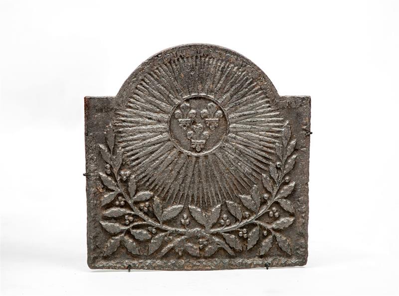 Appraisal: French Neoclassical Cast-Iron Fireback Early th Century With custom wall-mounted