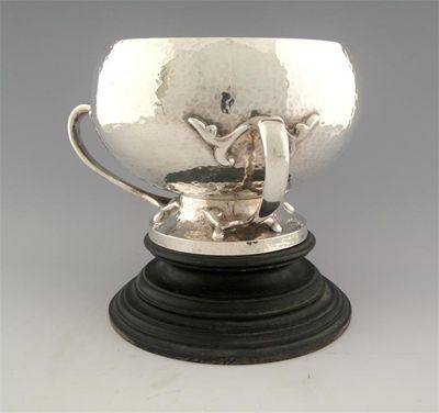 Appraisal: An Edwardian Art Nouveau globular rose bowl with a hammered