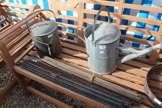 Appraisal: TWO OLD WATERING CANS two old rakes a sieve and