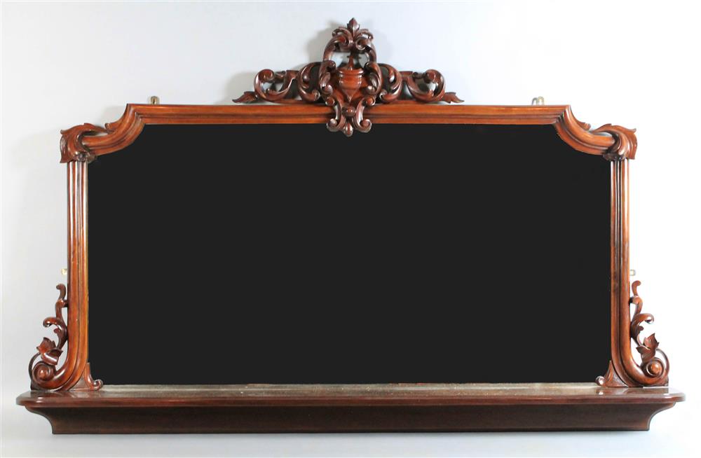 Appraisal: LARGE CARVED MAHOGANY MIRROR having a carved pediment over a