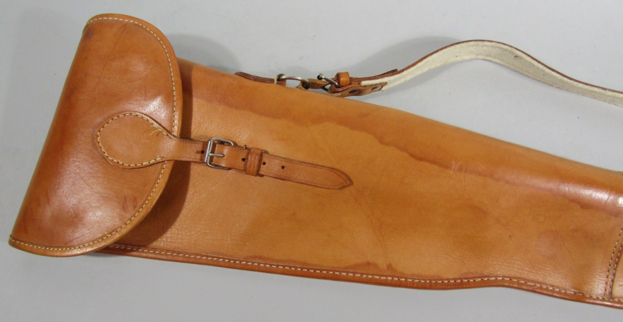 Appraisal: A tan leather shoulder gun case