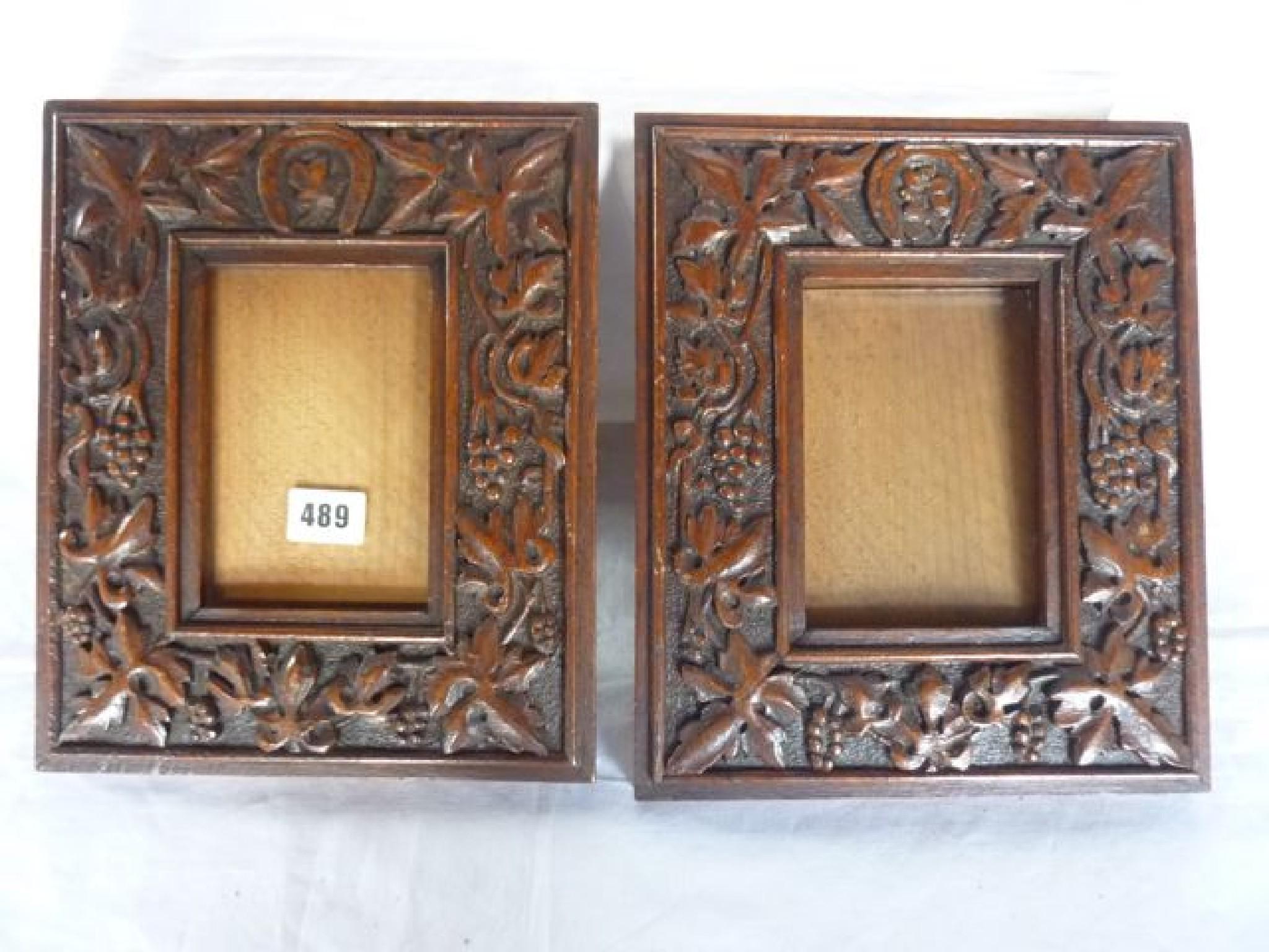 Appraisal: A pair of Victorian carved oak picture frames with trailing