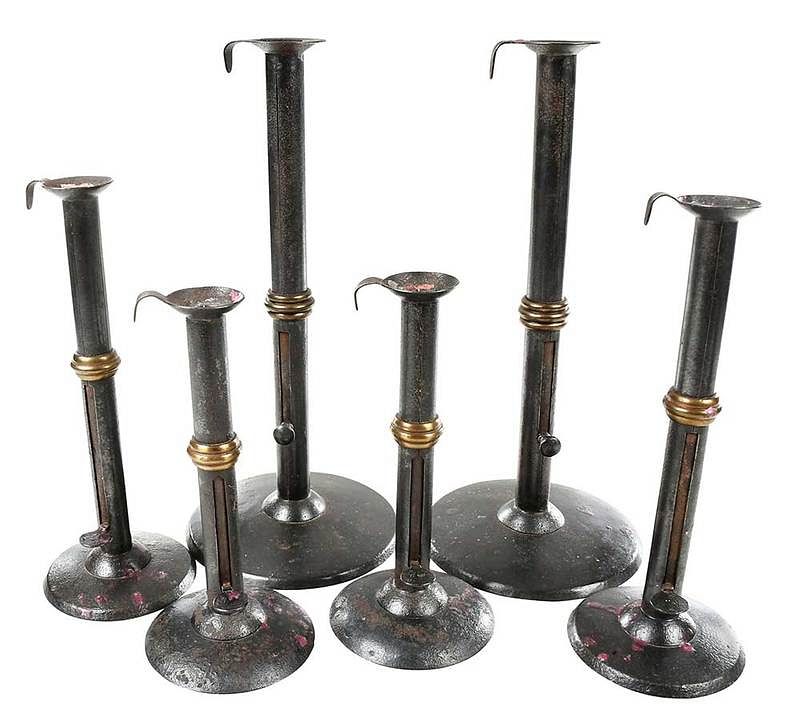 Appraisal: Three Pairs Wedding Band Hogscraper Candlesticks th century sheet iron