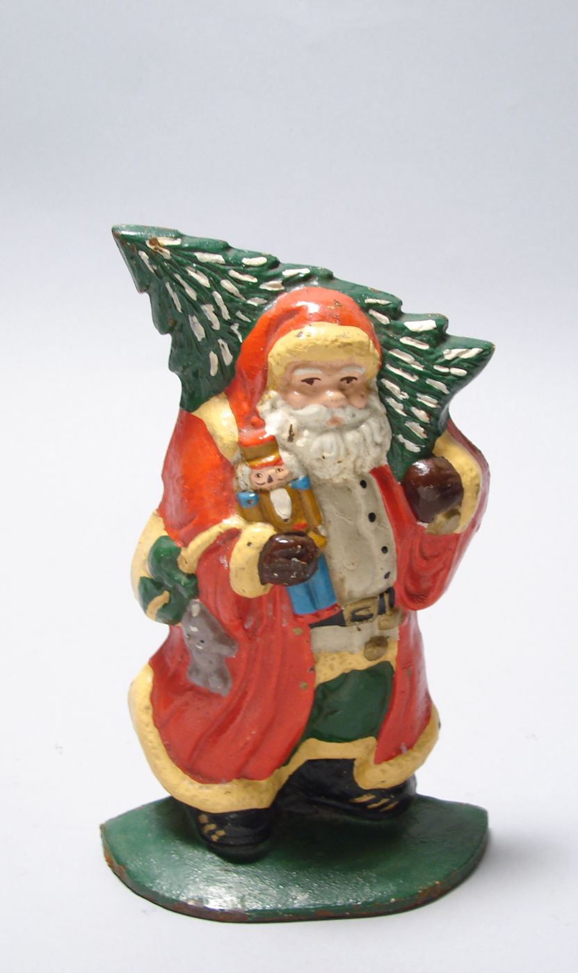 Appraisal: CAST IRON DOORSTOP th CenturyIn the form of Santa Claus