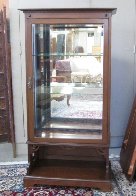 Appraisal: MAHOGANY AND GLASS CHINA CABINET ON STAND Continental c a