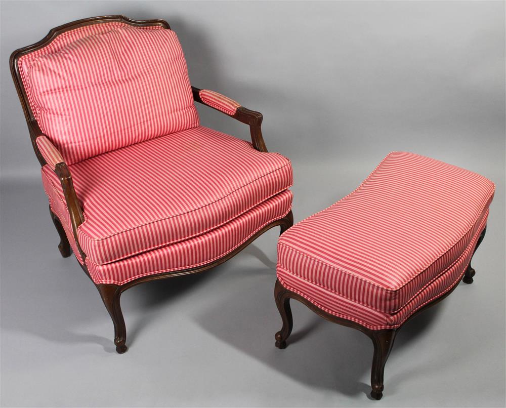 Appraisal: LOUIS XV STYLE FAUTEUIL WITH FITTED MATCHING OTTOMAN having a