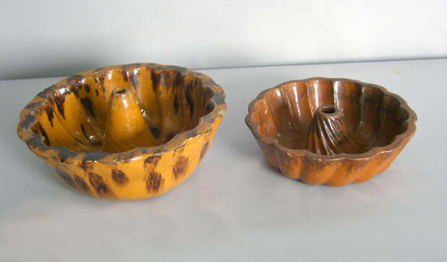 Appraisal: Two redware molds th c h w and h w