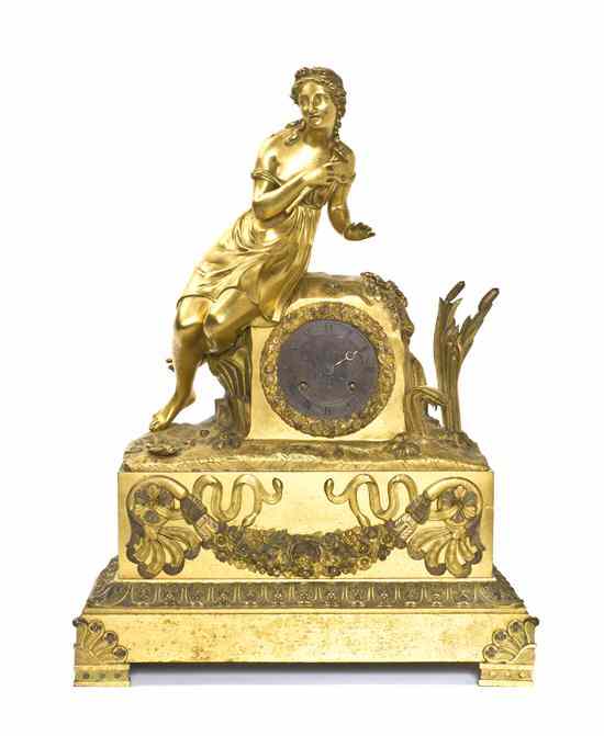 Appraisal: A French Gilt Bronze Figural Mantel Clock cast with a