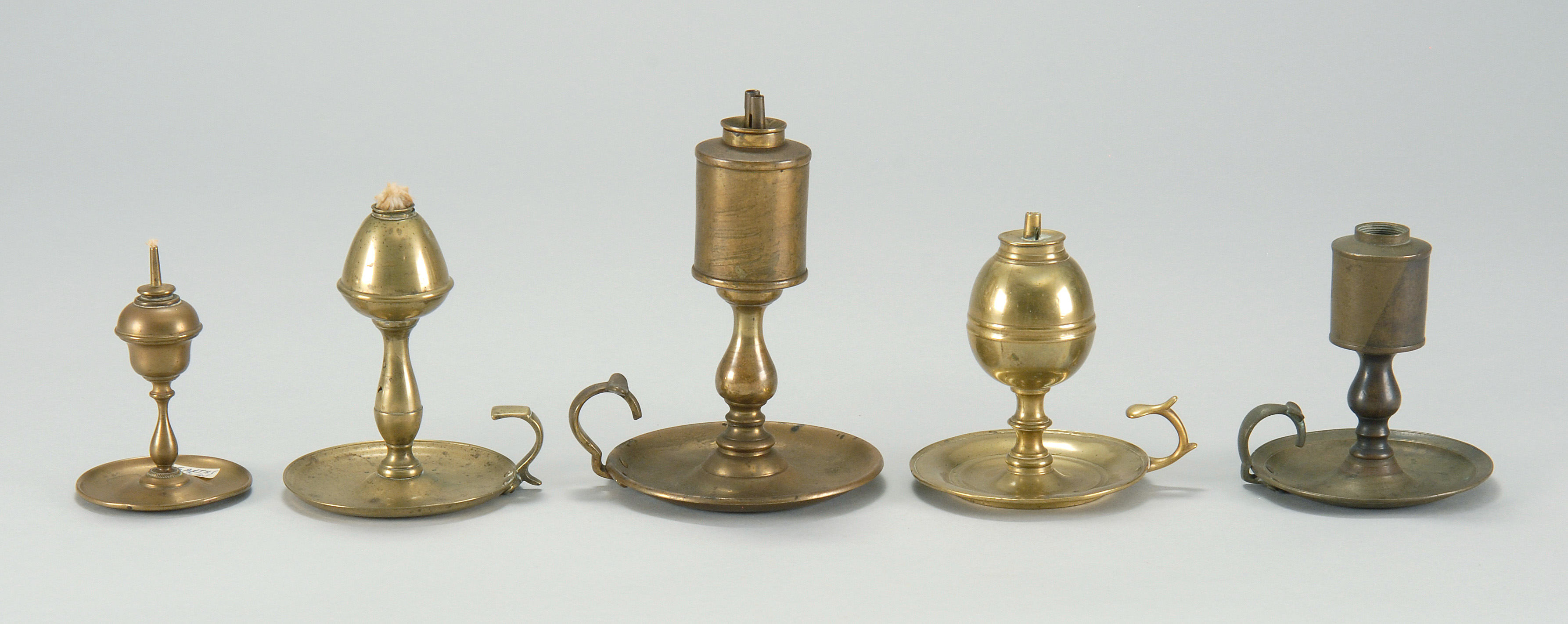 Appraisal: FIVE ANTIQUE BRASS WHALE OIL LAMPS mostly th Century English