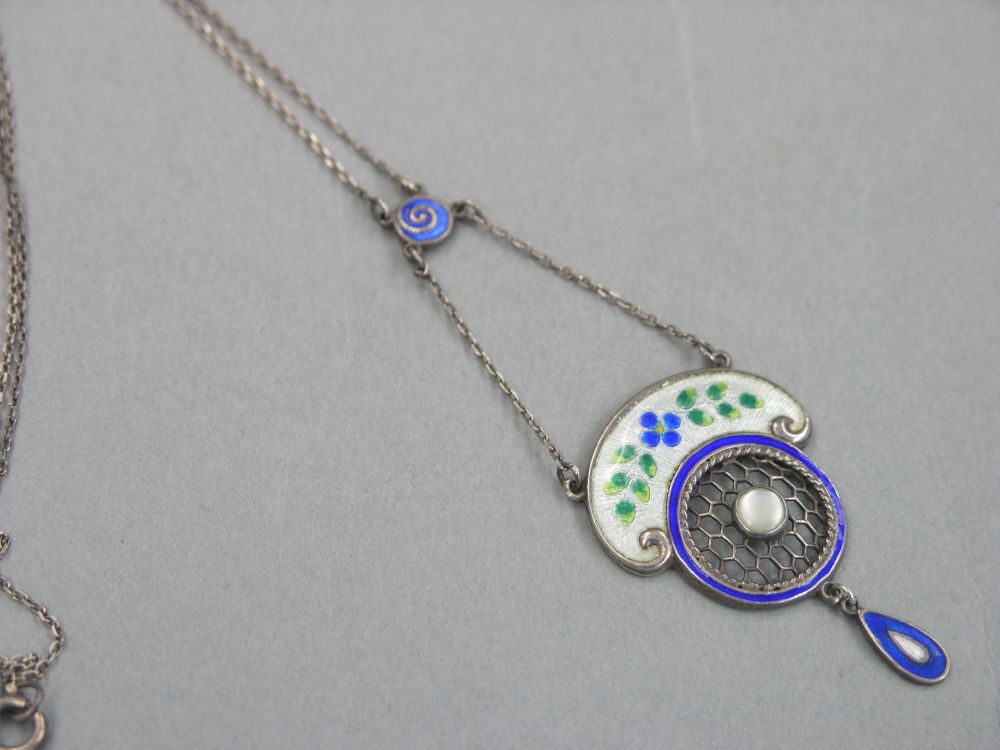 Appraisal: An Art Nouveau enamelled silver pendant on chain stylised form