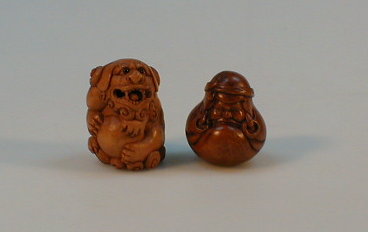 Appraisal: Two carved wooden reproduction ojime beads