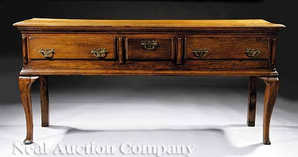 Appraisal: A Queen Anne Oak Dresser Base having a molded top