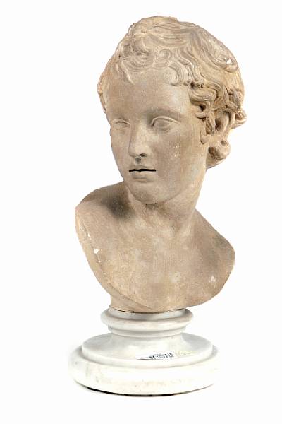 Appraisal: A carved limestone bust of a young woman on marble