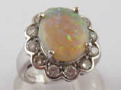 Appraisal: An carat white gold opal and diamond ring opal approx