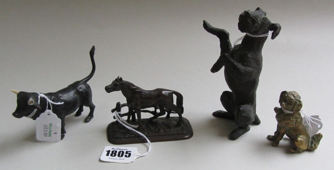 Appraisal: A miniature patinated bronze bull early th century cm high