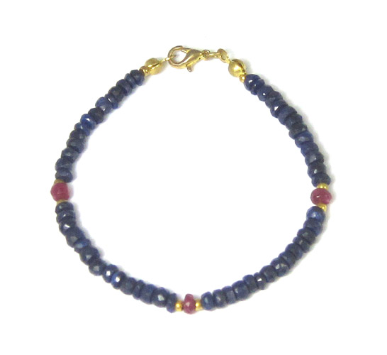 Appraisal: SAPPHIRE AND RUBY BRACELET inches in length strung with faceted