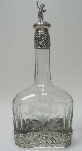 Appraisal: A Sterling Mounted German Crystal Decanter the glass engraved with