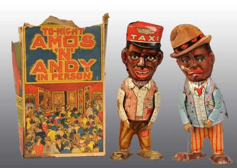 Appraisal: Tin Marx Amos 'N Andy Walker Wind-Up Toys Description American