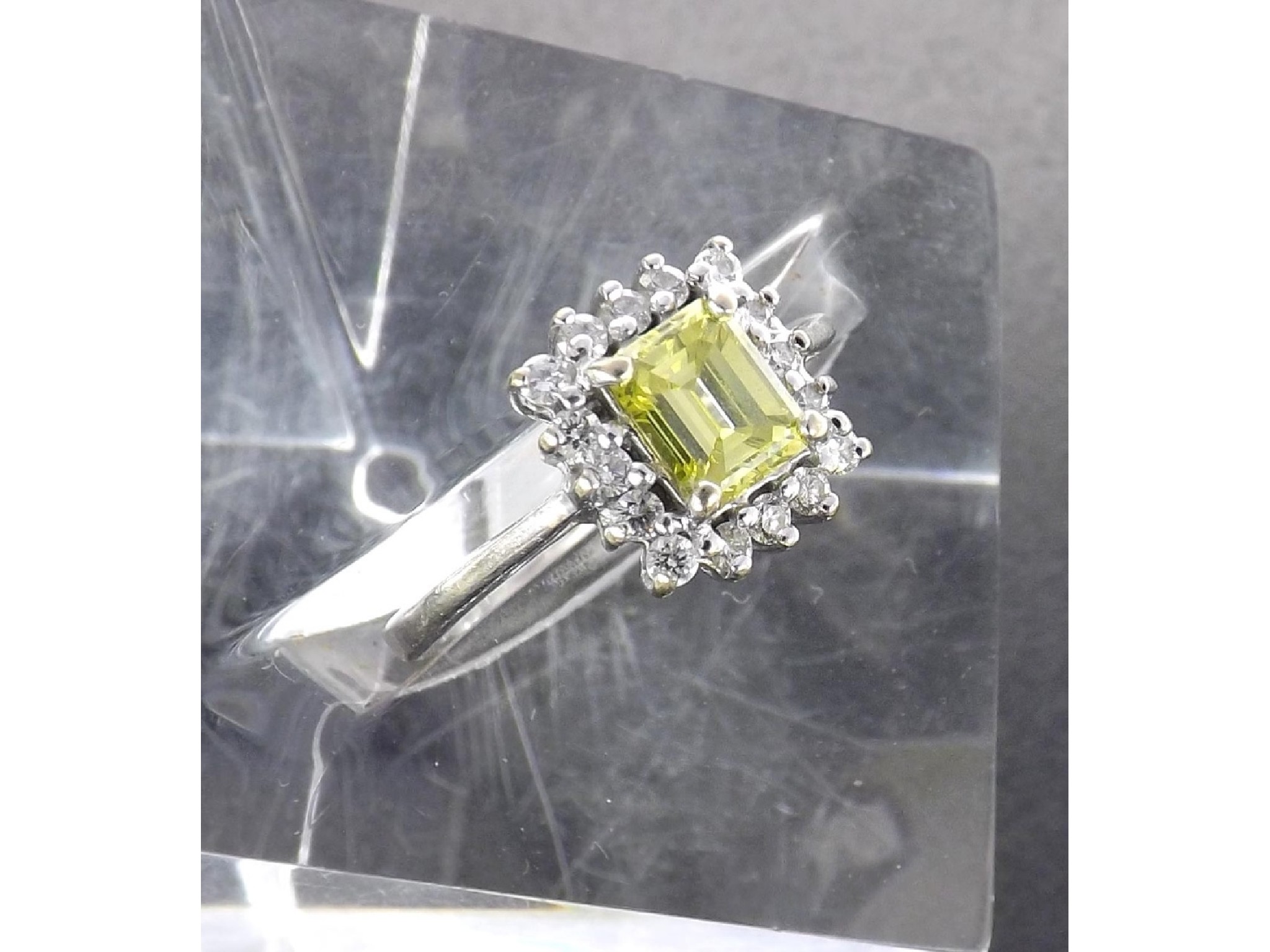 Appraisal: ct yellow diamond cluster ring the emerald-cut yellow diamond in