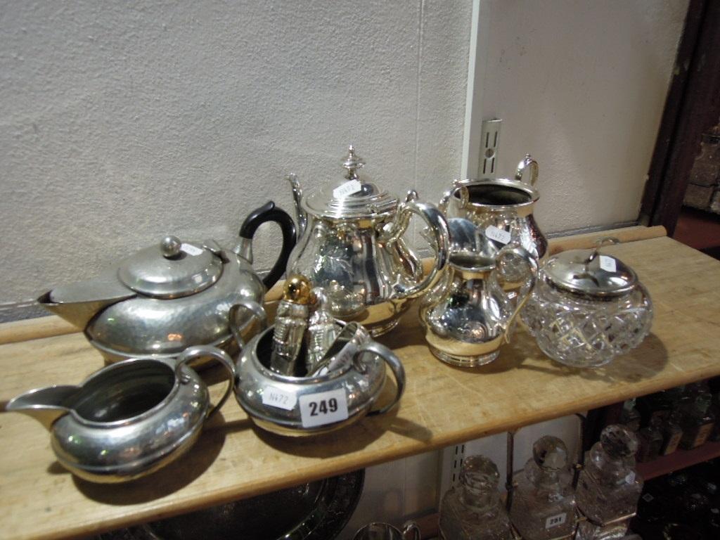 Appraisal: A three piece English pewter tea service with hammered finish