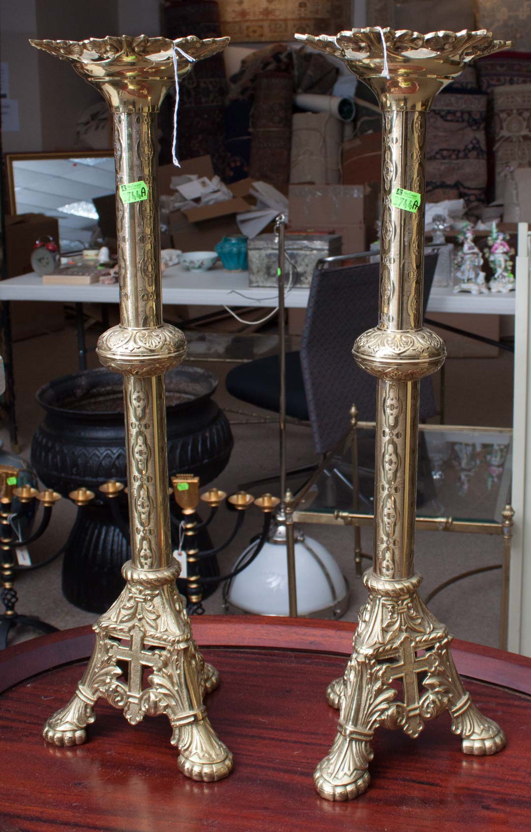 Appraisal: a Pair of brass religious candlesticks