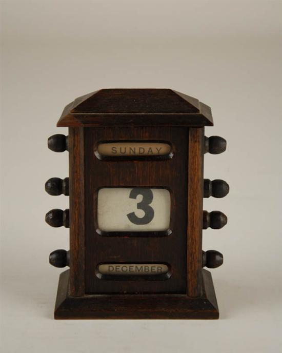 Appraisal: Oak Arts Crafts-style Perpetual Desktop Calendar displaying day of the