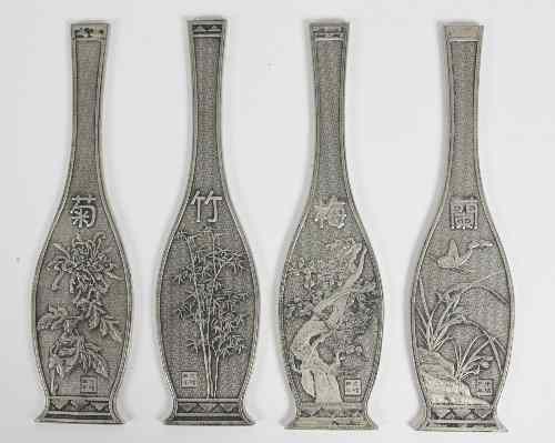 Appraisal: A set of four Chinese silver bottle shaped tablets cast