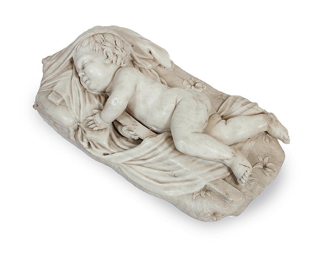 Appraisal: A TH CENTURY CARVED MARBLE SCULPTURE of a child resting