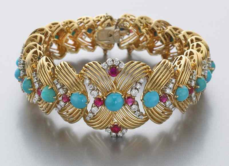 Appraisal: K gold turquoise diamond and ruby braceletfeaturing cabochon cut Persian