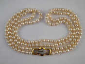 Appraisal: A two row cultured pearl necklace with a yellow metal