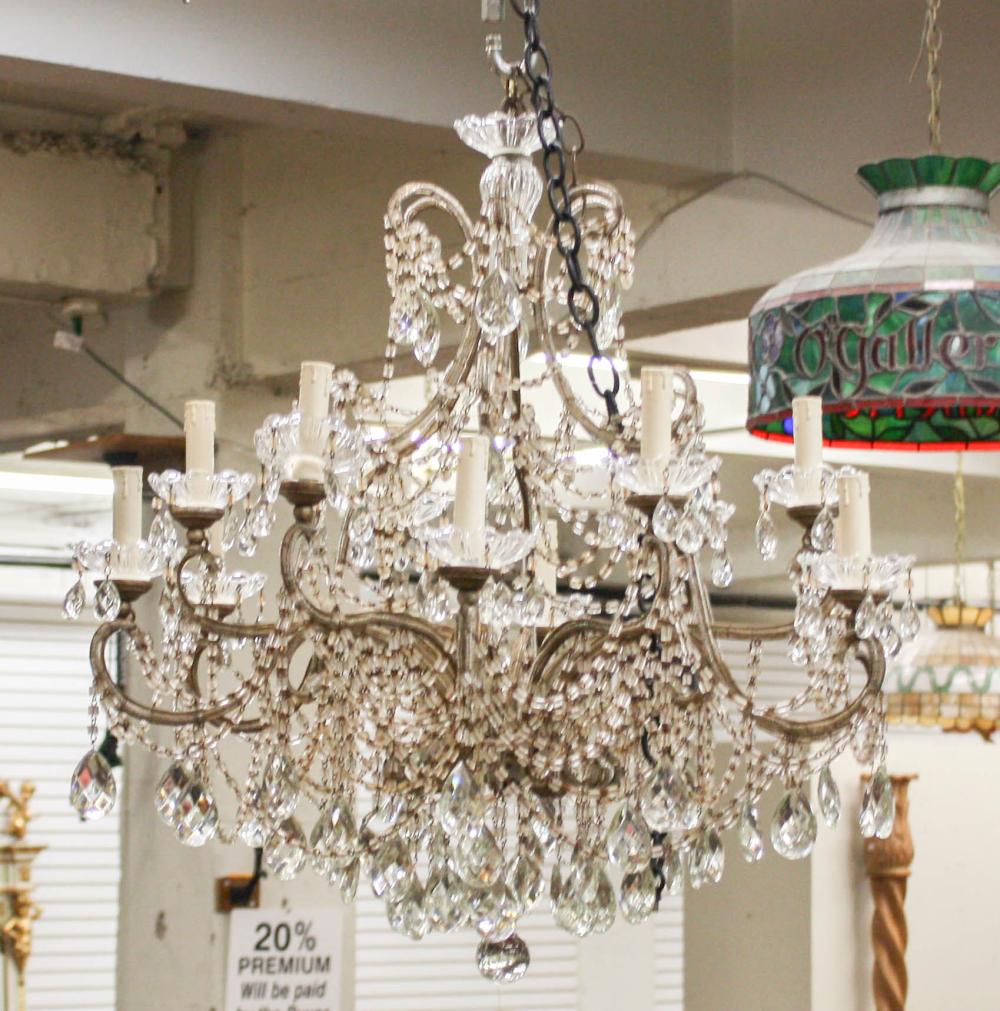 Appraisal: FRENCH STYLE TWELVE-LIGHT CHANDELIER the metal frame strung with chains